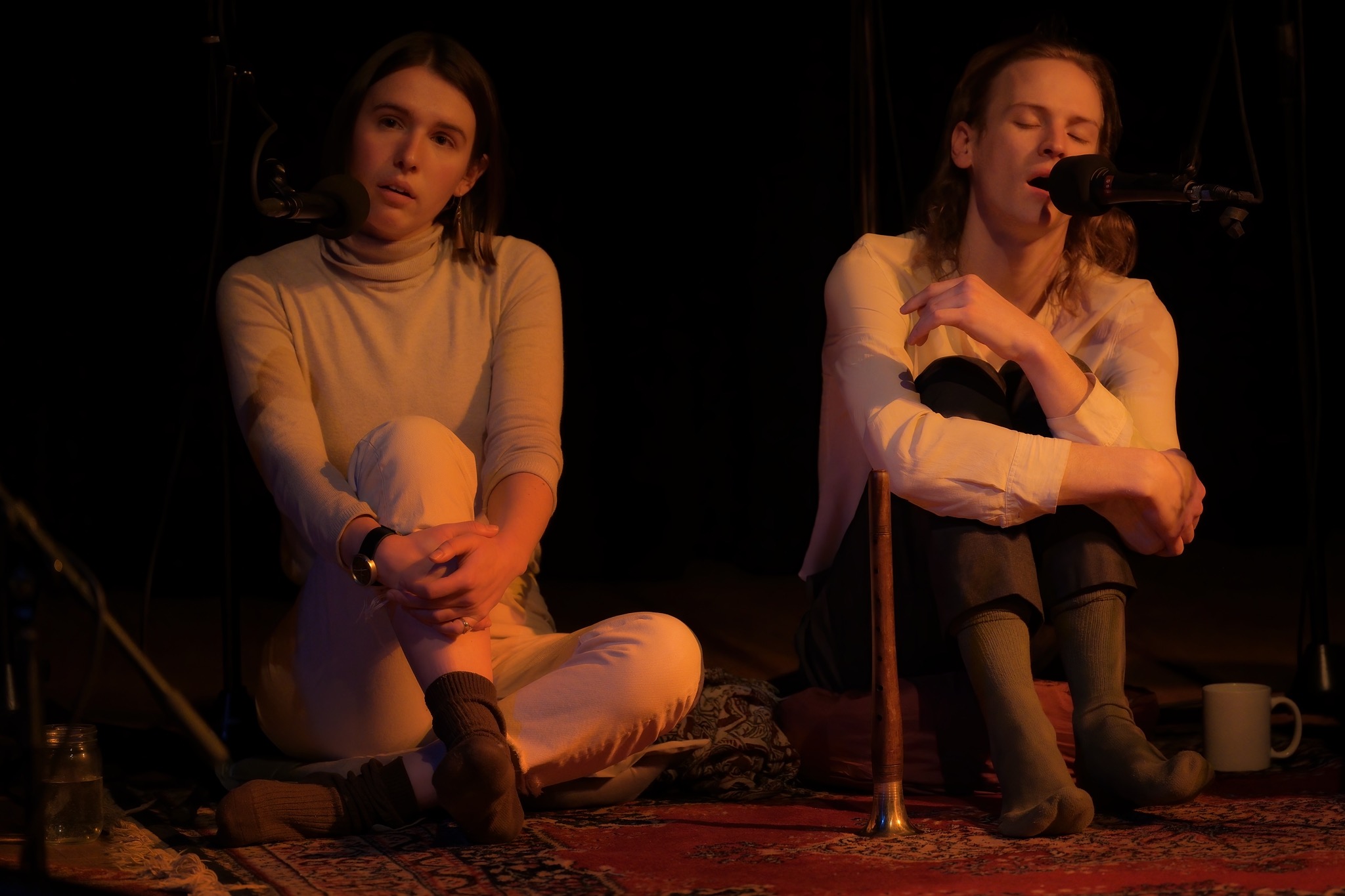 Vocalists seated during performance