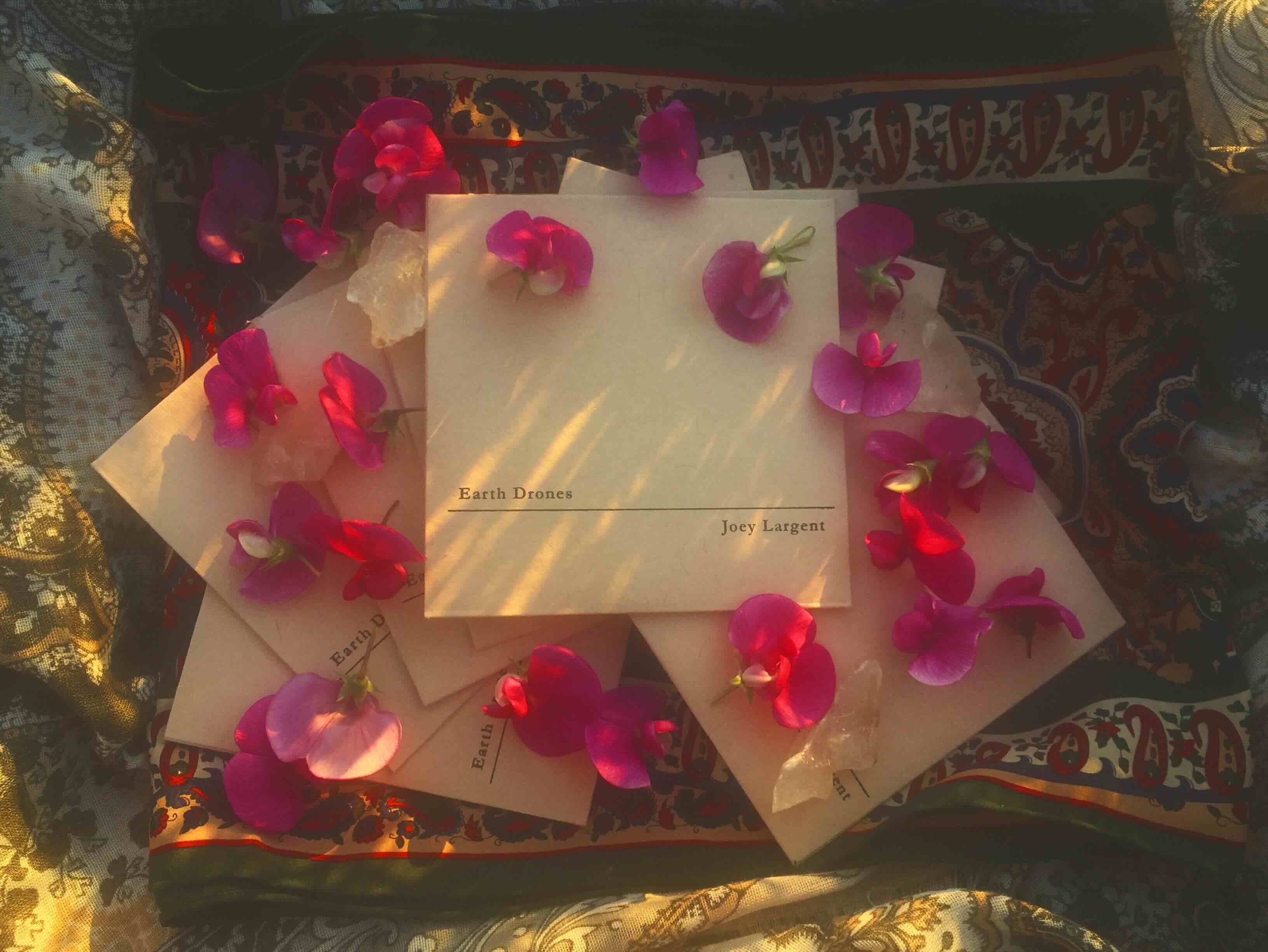 CDs arranged on fabric with flowers