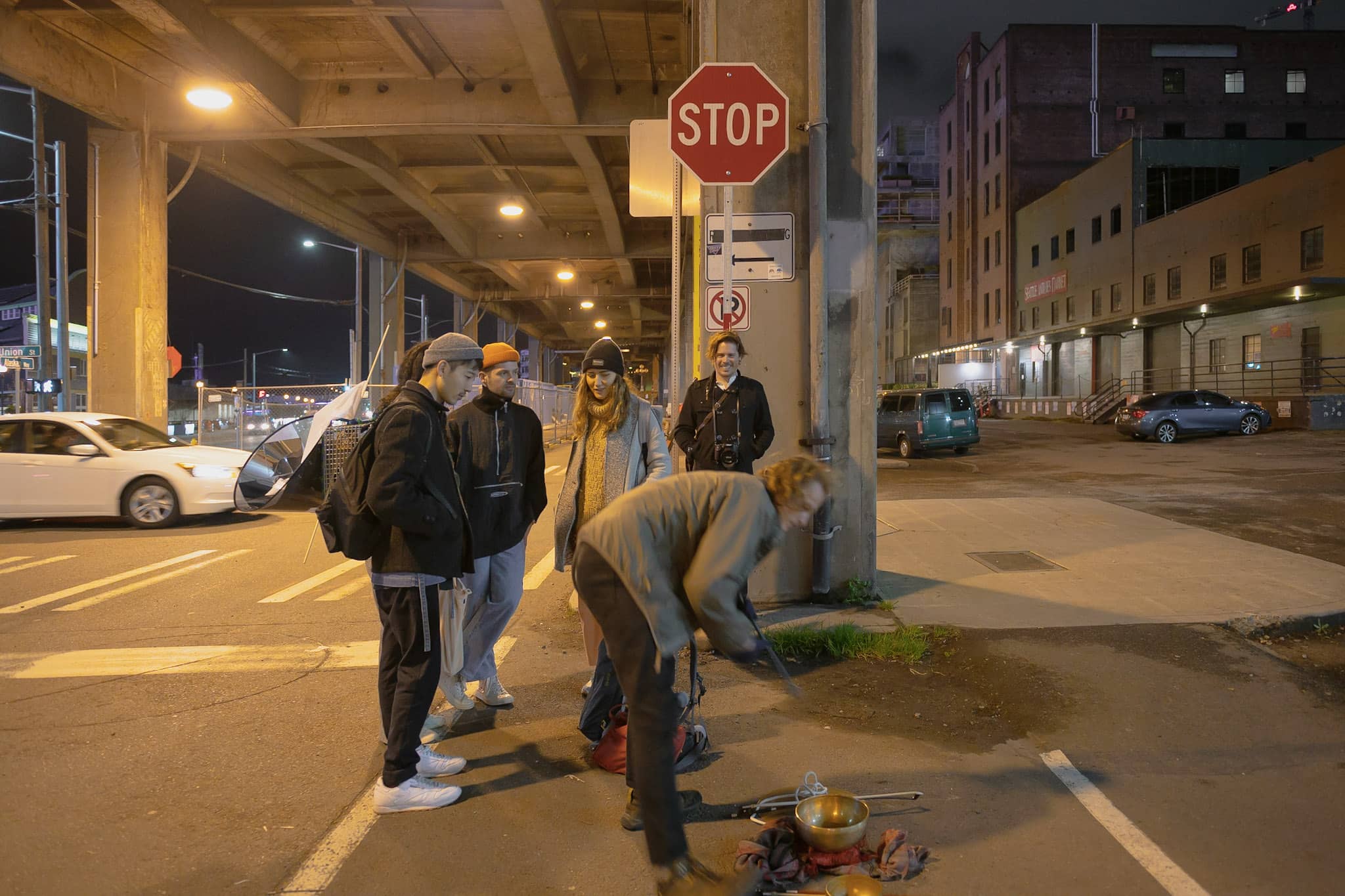 Participants preparing An Offering under the Seattle viaduct