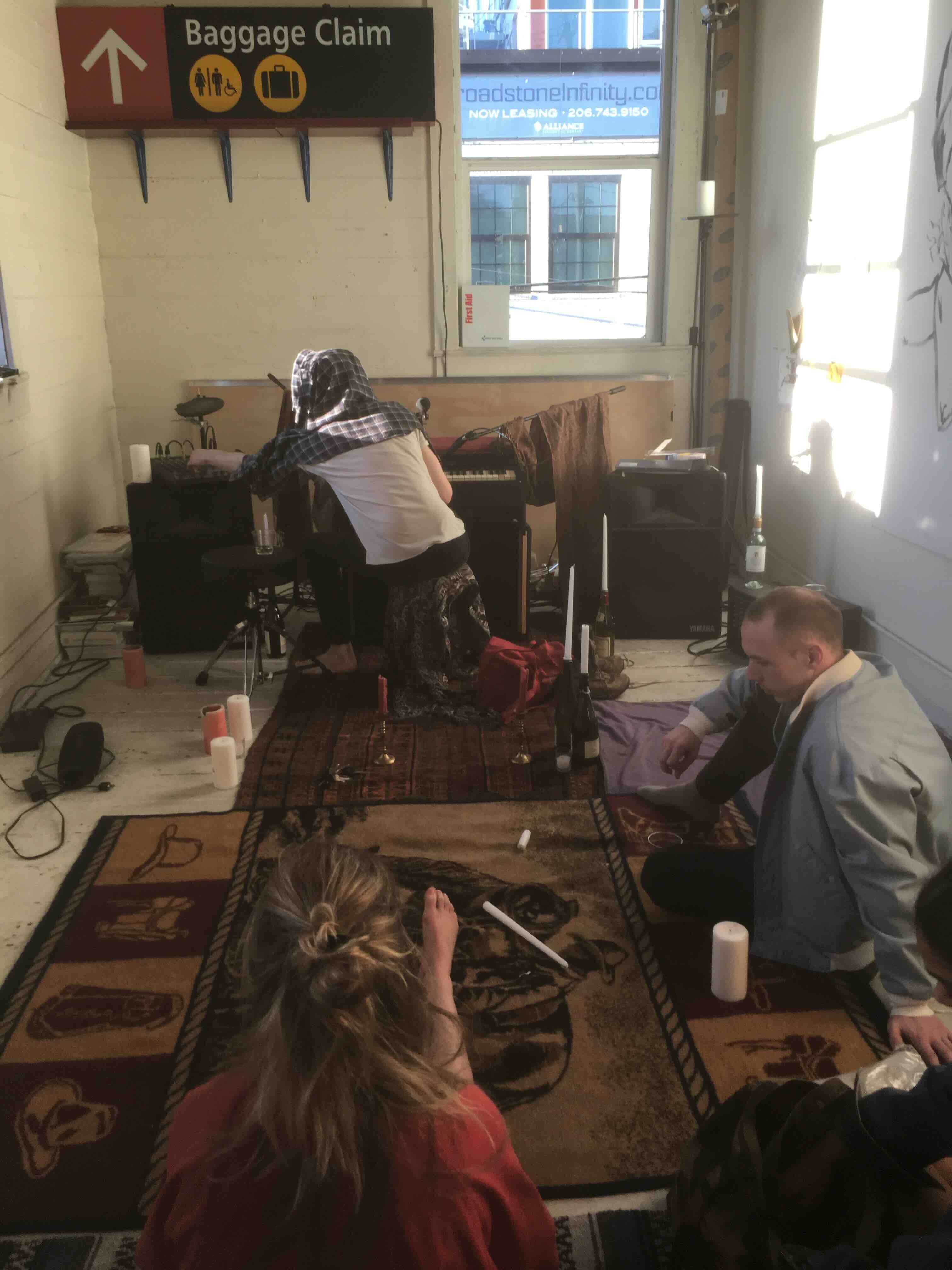 Audience seated around organ installation at The Annex