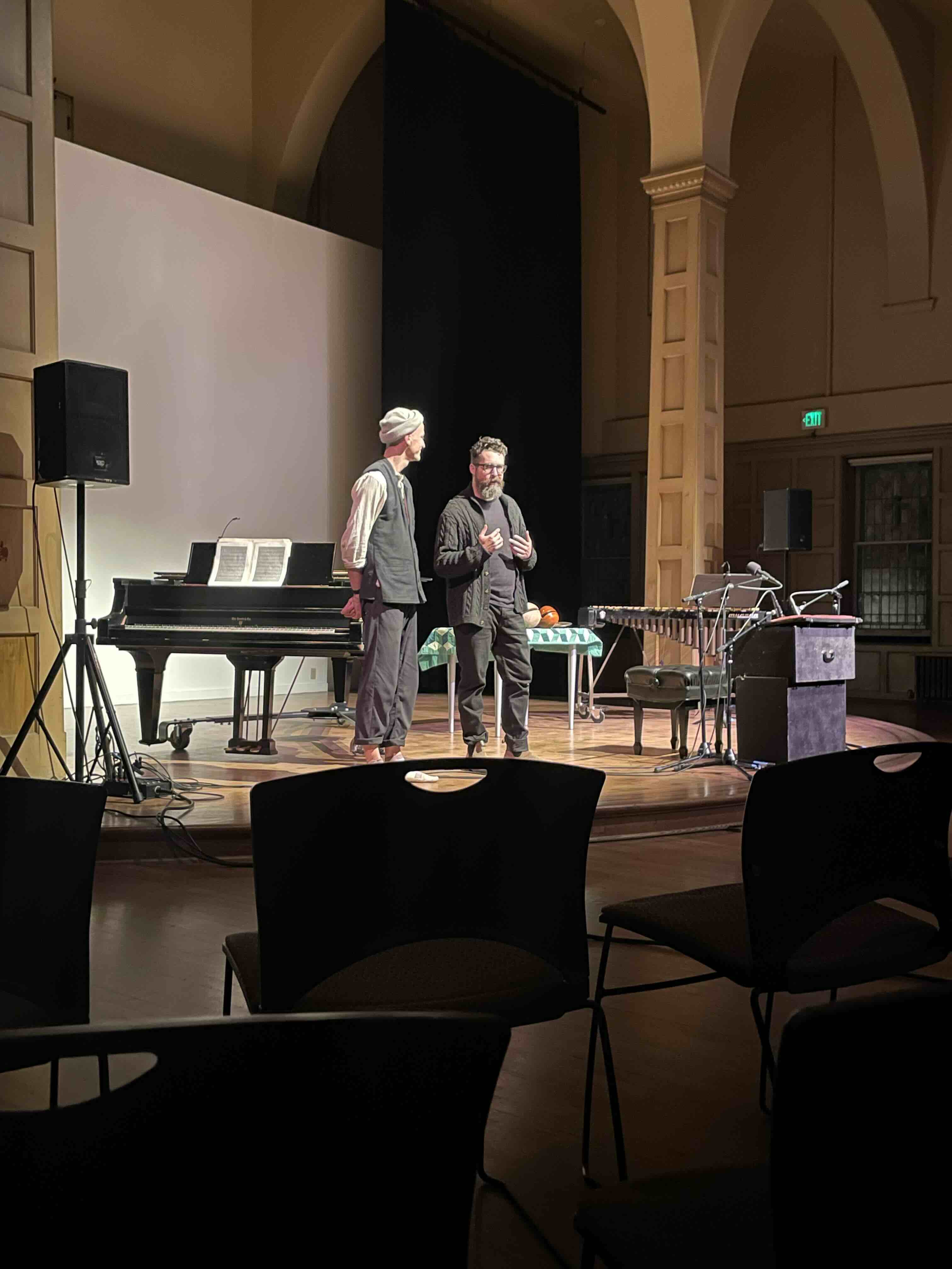 Joey Largent and Nat Evans speaking on stage at Chapel Performance Space